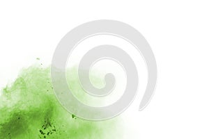 Green powder explosion on white background.