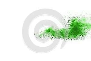 Green powder explosion on white background.