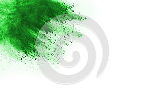 Green powder explosion on white background.