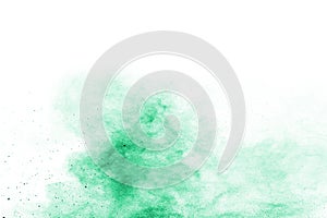 Green powder explosion on white background.