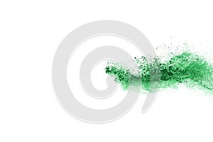 Green powder explosion on white background.