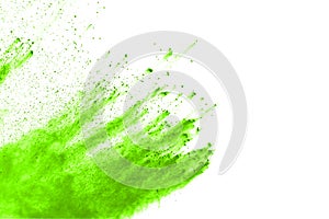 Green powder explosion on white background.