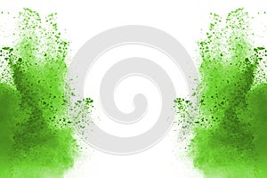 Green powder explosion on white background.