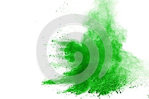 Green powder explosion on white background. Colored cloud. Color dust explode. Paint Holi.