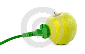 Green power cable attached to apple outlet