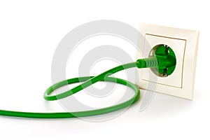 Green power plug into power outlet