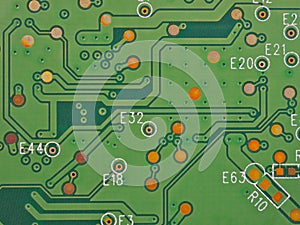 Green printed circuit board PCB hard drive. Fragment of printed wiring board PWB close up. Conductive pattern. IT&C. Background or