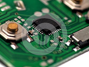 Green Printed Circuit Board PCB with some Surface Mount Device SMD components and chips