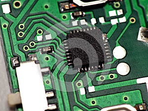 Green Printed Circuit Board PCB with some Surface Mount Device SMD components and chips