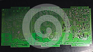 Green Printed Circuit Board (PCB) with some Surface Mount Device (SMD) components and chips