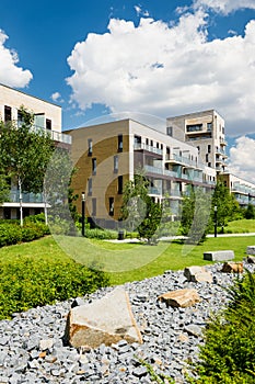 Green public park in the city with dry stony watercourse photo