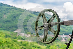 Green Pulley Wheel on the Shaft with Blur Mountain