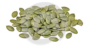 Green pumpkin seed heap isolated on white background