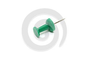 green push pin on white background