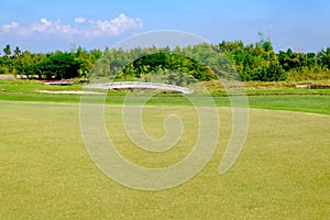 Green putt in golf course landscape