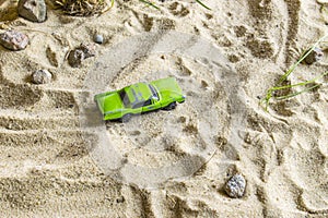 Green racing car on the track.