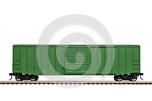 A Green Railroad Box Car On Railroad Track.