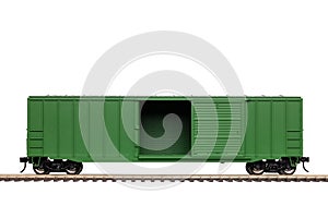 A Green Railroad Box Car On Railroad Track.