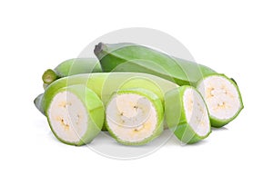 Green raw cultivated banana with slice isolated on white