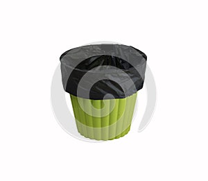 Green recycle bin has a black bag isolated on a white background. Prepared for trash. This picture have clipping path