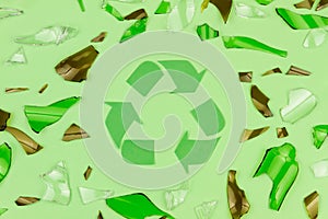 Green recycle sign symbol with shattered glass