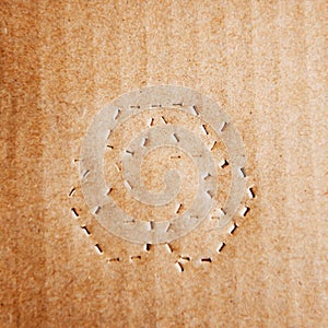 Green recycle symbol on cardboard