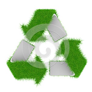 Green recycling symbol covered with grass