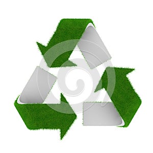 Green recycling symbol covered with grass