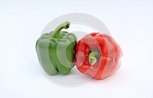 Green and red bell pepper isolated on white background