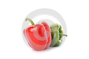 Green and red bell peppers isolated on white