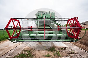 Green and red combine harvester, Latvia