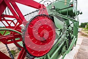 Green and red combine harvester, Latvia