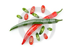 Green and red hot chili peppers and slices isolated on white background