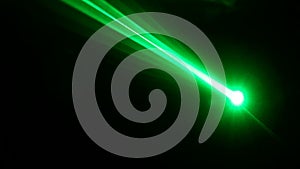 Green and red laser in a nightclub. Laser beams on a dark background, club atmosphere