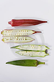 Green and red Okra or Ladyfingers on white background