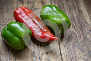 Green red pepper on a wooden surface, concept on the topic of healthy vegetables on the table, Shallow depth of field,