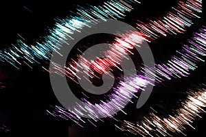 Green red purple colorful neon light of firework abstract in the dark night city black background