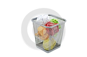 Green,red,white,and yellow crumple paper on metal dustbin