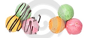 Green red and yellow ice cream ball with melted chocolate isolated on white background, top view