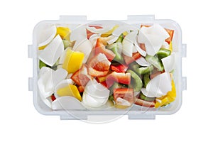 Green red yellow sweet pepper chilly and onion in plastic box container