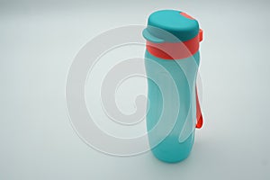 Green refillable drink bottles on white background