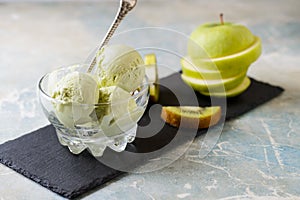 Green refreshing pistachio ice cream in glass bowl