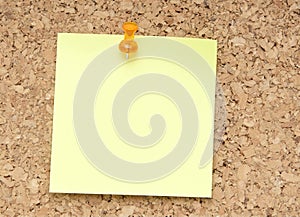 Green reminder note with orange pin