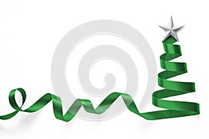 Green ribbon Christmas tree made of satin bow scroll with silver star isolated on white background with clipping path for winter