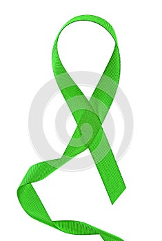 Green ribbon on white background. Medical concept - mitochondrial diseases and kidney cancer concept photo