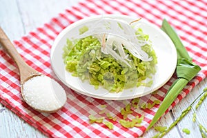 Green rice sweet with ears of rice pandan leaf, Thai dessert - pounded unripe rice food rice flakes cereal with coconut and sugar