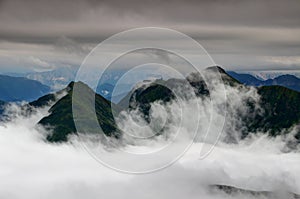 Green ridges in clouds, Carnic Alps Friuli Venezia Giulia Italy