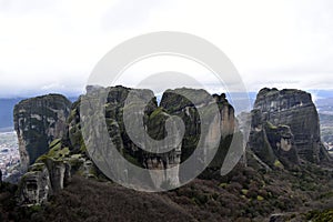 Green Rock over the cloudly sky