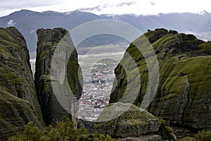 Green Rock over the cloudly sky