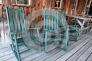 Green rocking chairs on porch